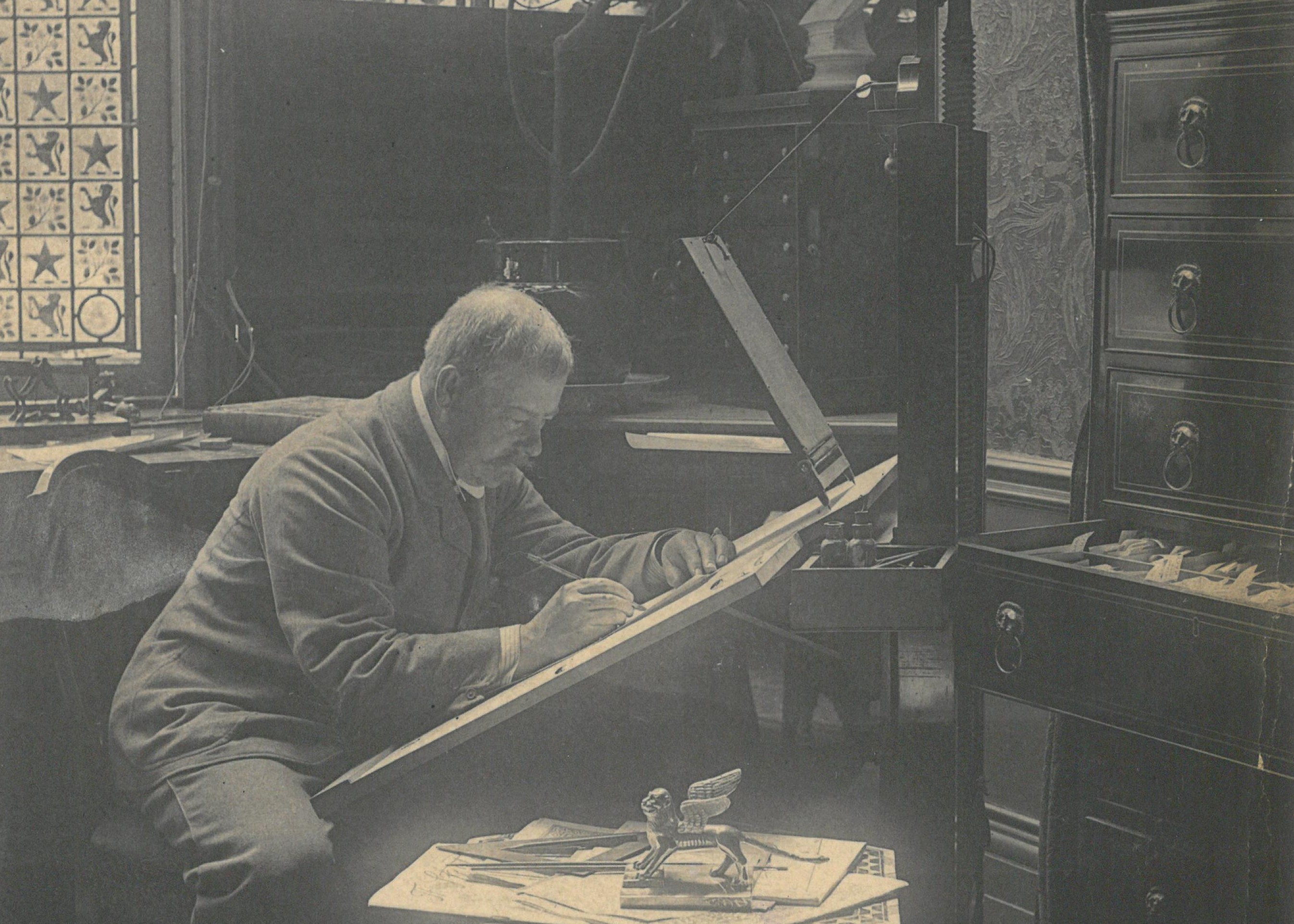 Photograph of Linley Sambourne at work in Drawing Room at Sambourne House.