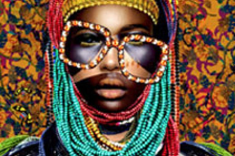 A portrait of a Black person in colourful clothing