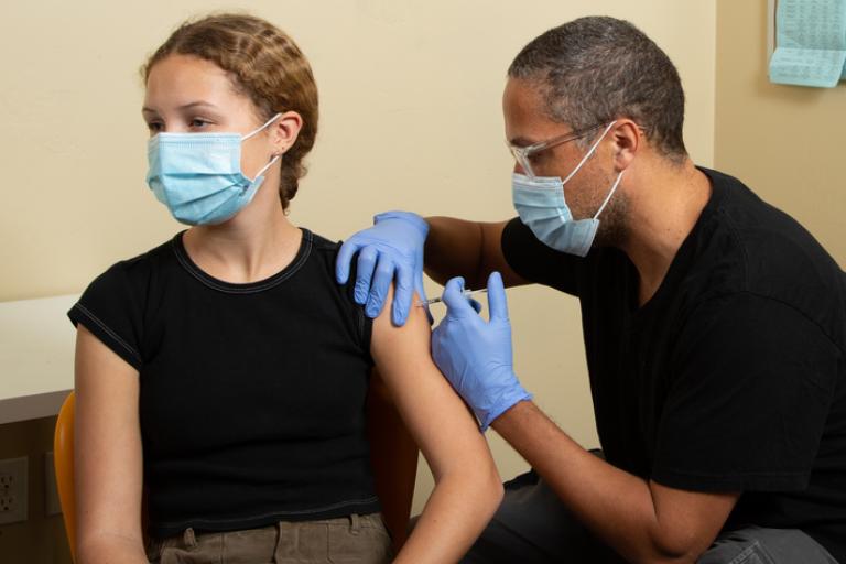 Young person receiving their Covid vaccination