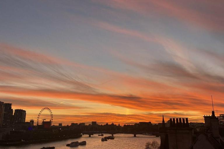 The sunset sky over the river thames in london