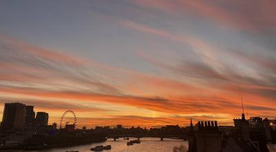 The sunset sky over the river thames in london